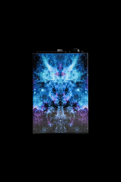 A vibrant, cosmic-themed cannabis grinder featuring a swirling blue and purple nebula design.