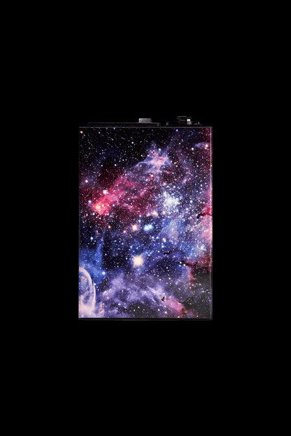 Nebula-patterned rolling tray with cannabis accessories.