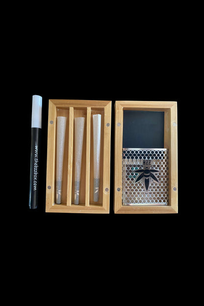 Wooden cannabis storage box open, displaying rolled joints and a honeycomb patterned compartment with a cannabis leaf design.