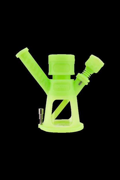 Neon green silicone bubbler with a metal coil and downstem.