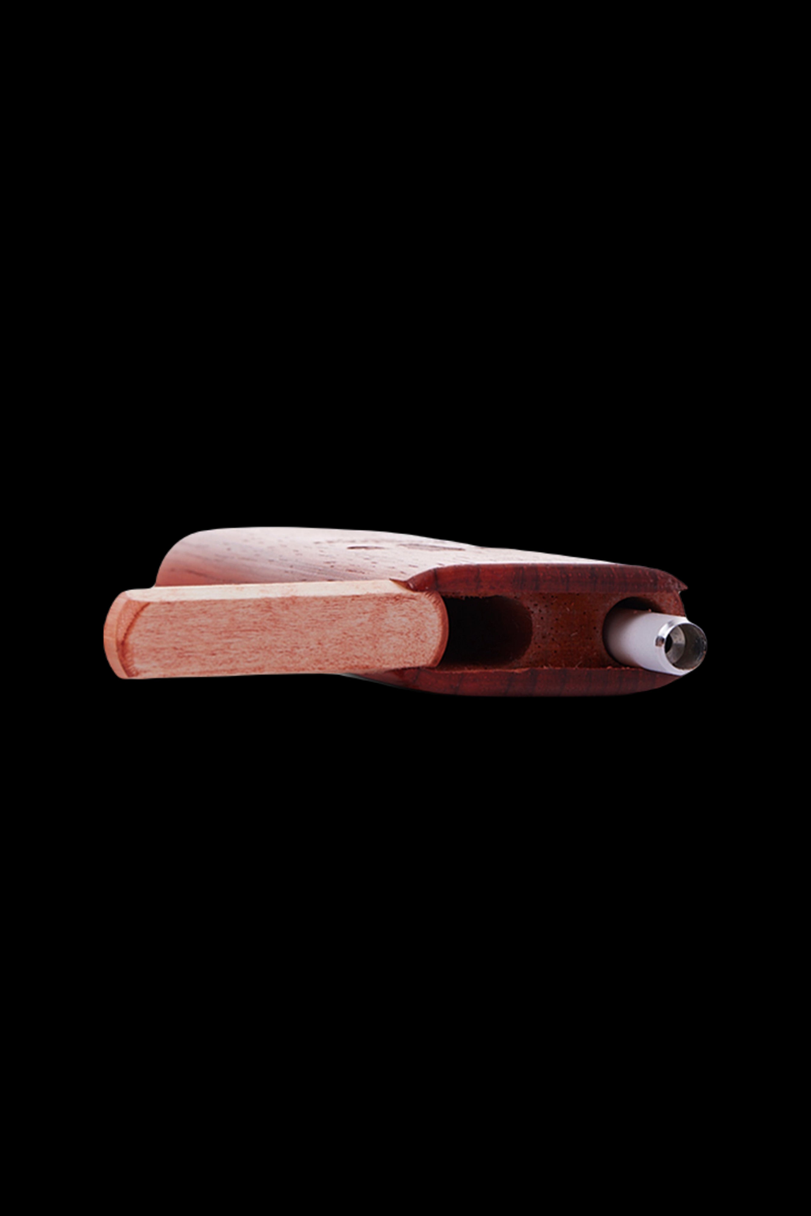 Wooden dugout with a metal end piece, isolated on a black background.