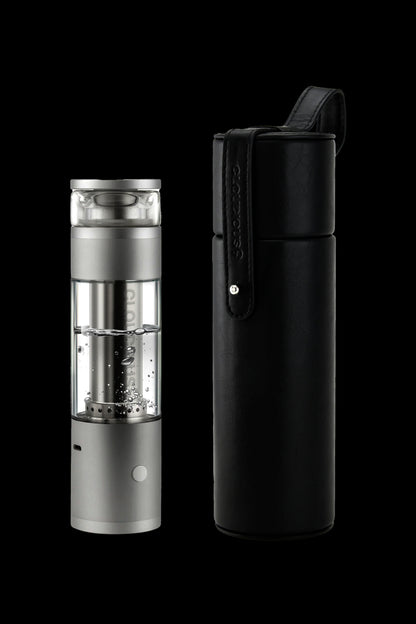 Silver and black cannabis e-rig with a carrying case, studio shot on a black background.