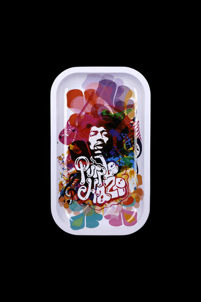 A rectangular metal rolling tray with colorful, psychedelic artwork featuring a portrait of Bob Marley and the text "Purple Haze."