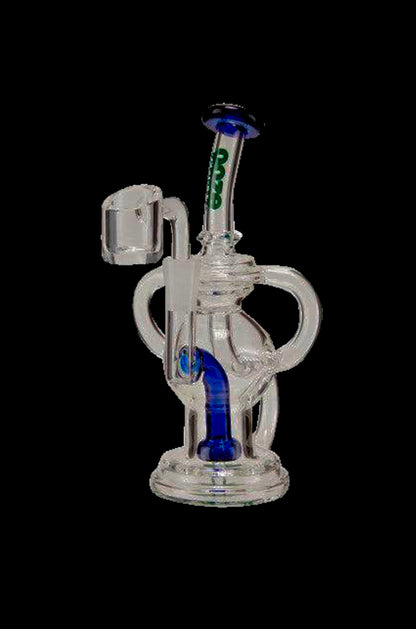 Clear glass dab rig with blue accents and a quartz banger.