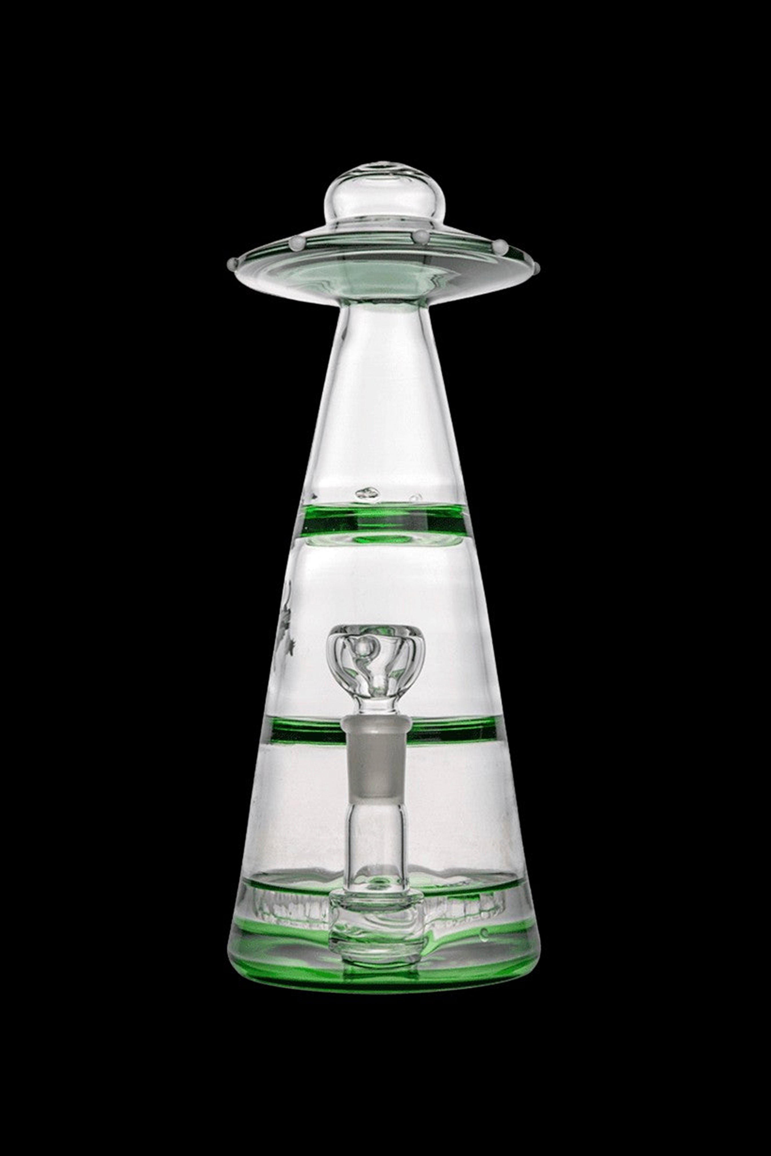 A clear glass water pipe shaped like a UFO with green accents.