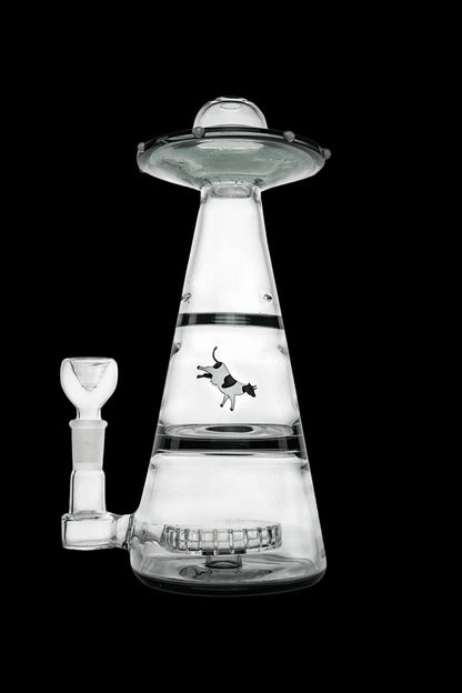 Glass water pipe shaped like a UFO with a cow graphic.