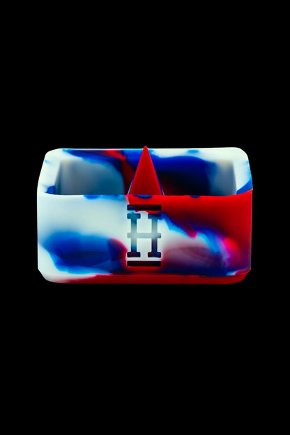 Silicone cannabis oil container with red, white, and blue marbled design, featuring a triangular peak and "II" logo.