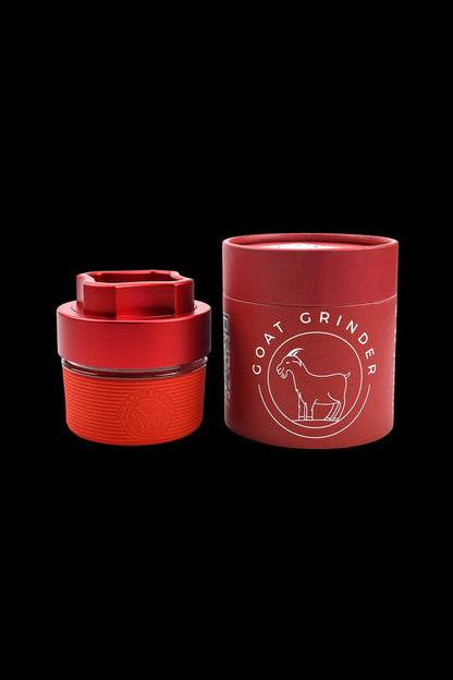 Red cannabis grinder and container with a goat illustration.