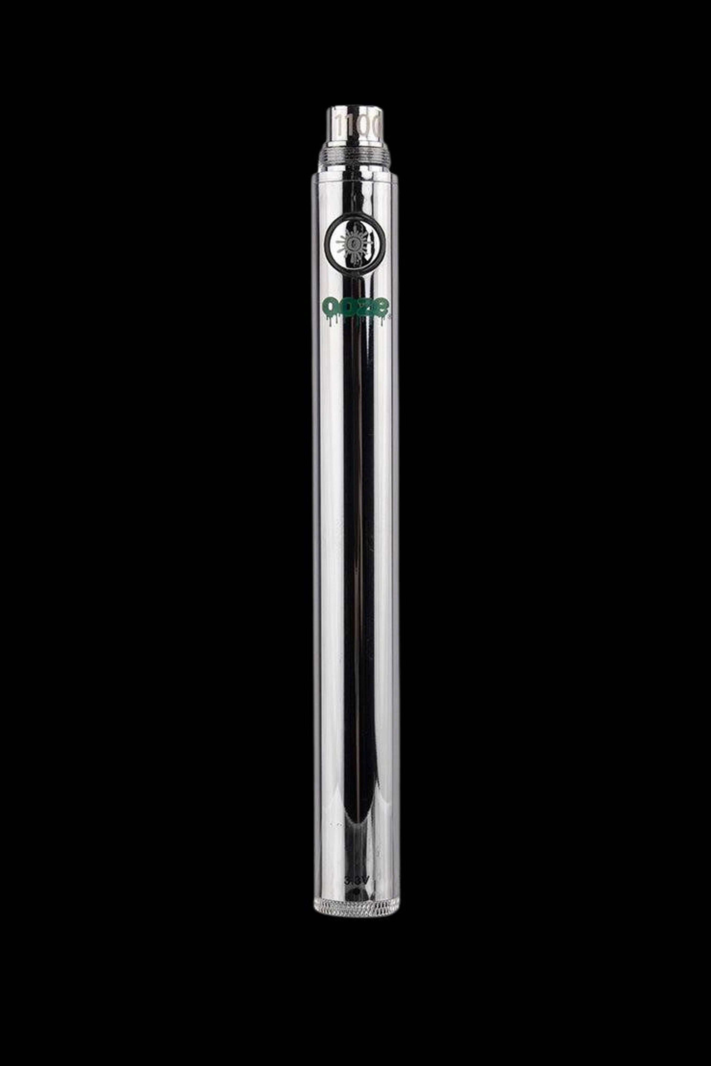 Silver cannabis oil vape pen with clear glass cartridge, displaying a green “Dope” logo.