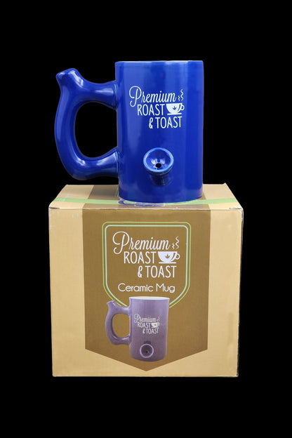 Blue ceramic mug with built-in glass pipe, presented in its branded box labeled “Premium Roast & Toast.”