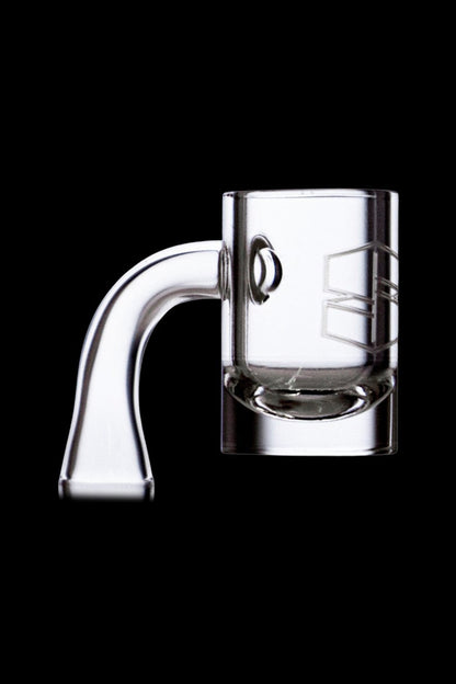 Clear quartz dab rig nail with etched design, isolated on black.