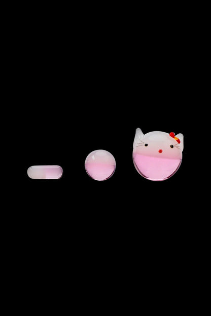 Three-piece front view of The Stash Shack Pinky Kitty Glass Slurper Set showing a pink gradient cat-shaped slurper and two matching rounded accessories on black.