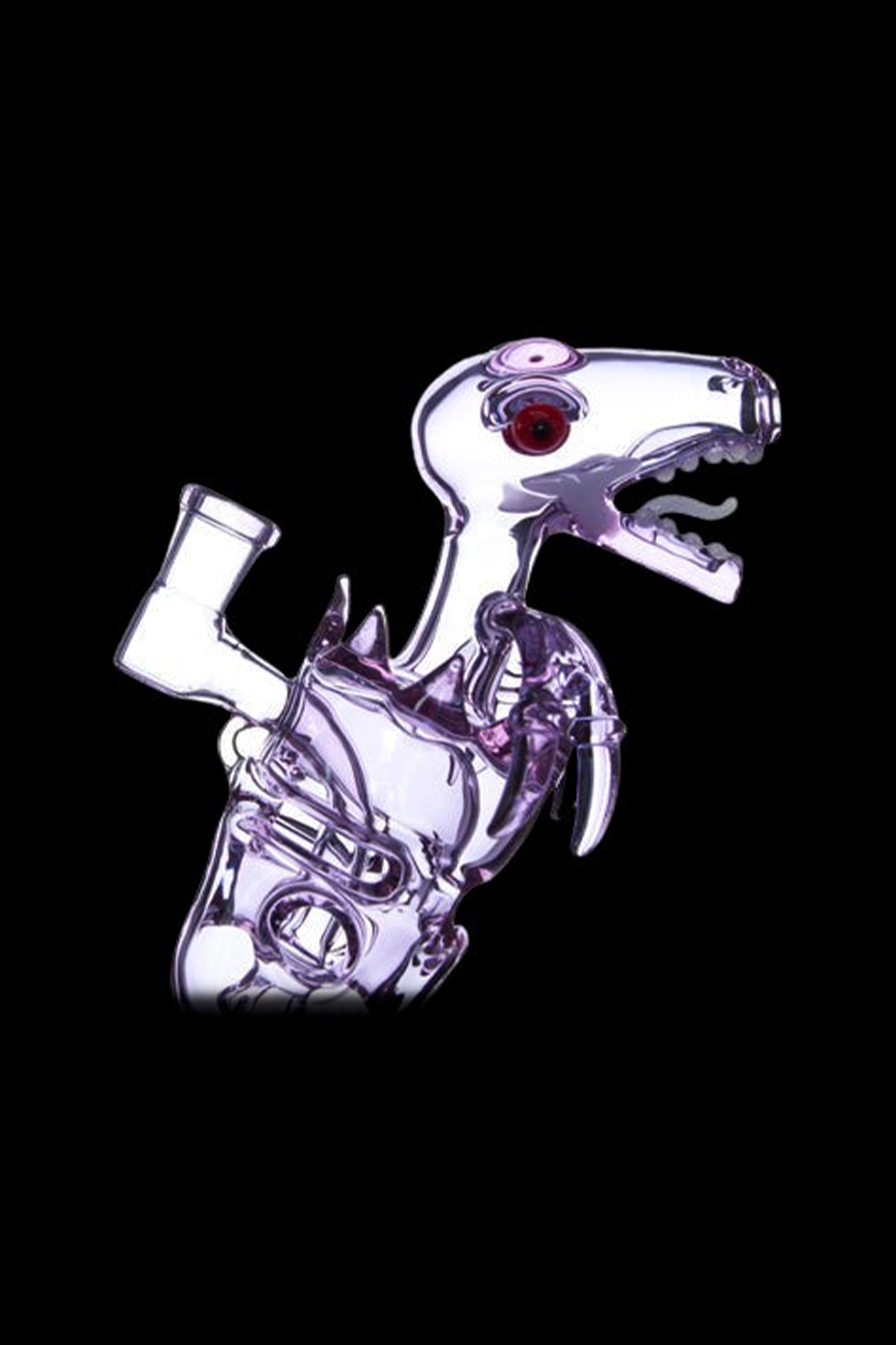 Close-up side view of a lime-green glass Calibear Fab Dino Rig shaped like a skeletal dinosaur head and neck against a black background