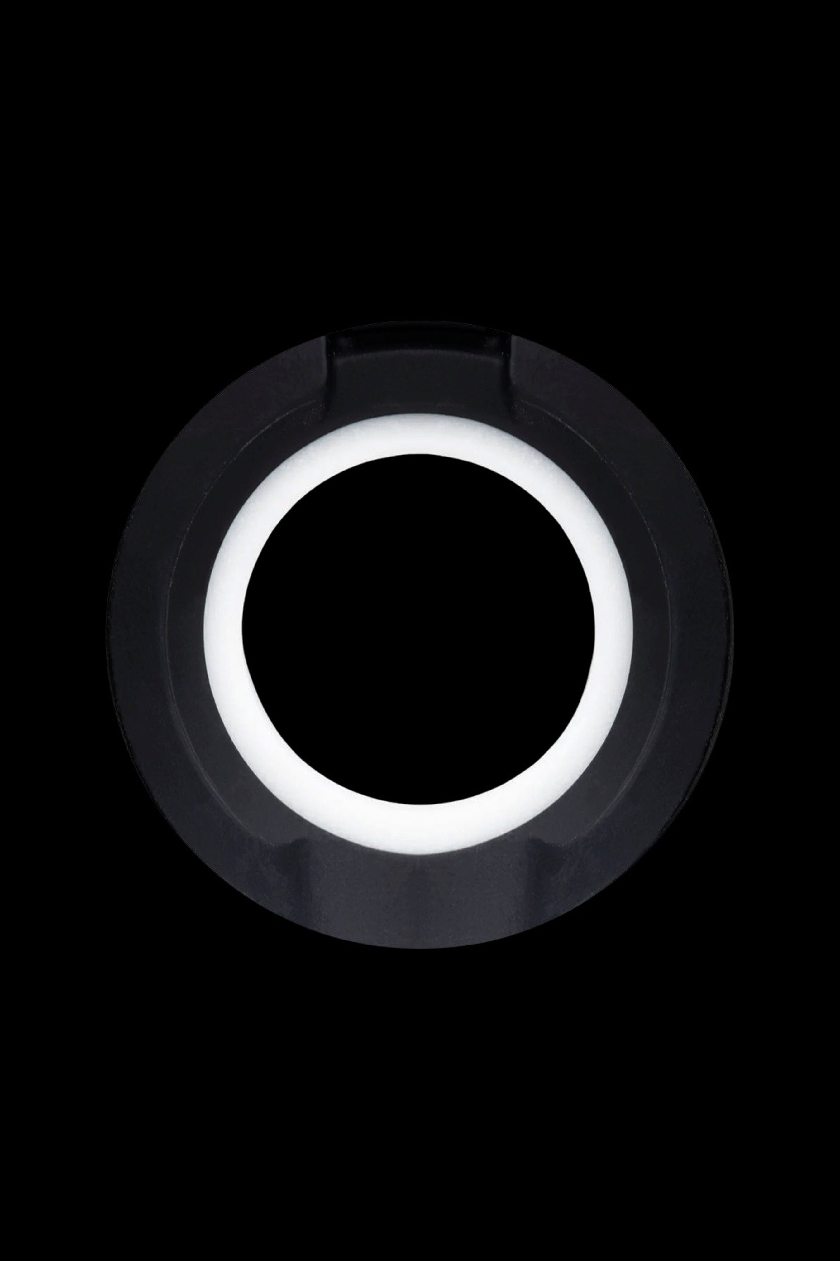 Black cannabis oil vape cartridge with a glowing white ring.