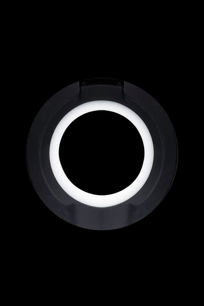 Black cannabis oil vape cartridge with a glowing white ring.