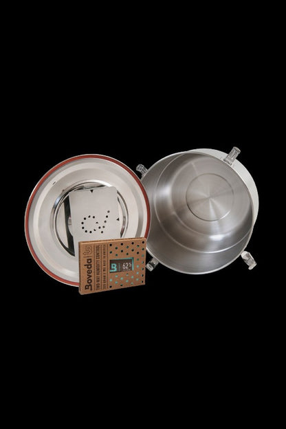 Open glass cannabis storage jar with a Boveda humidity pack inside.