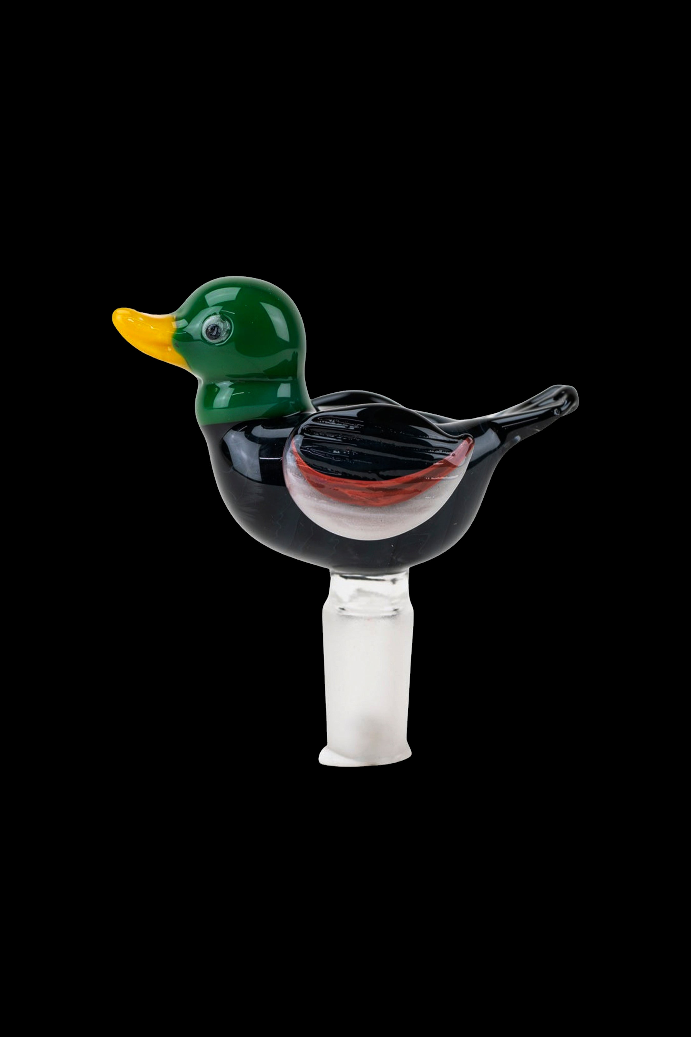 Glass duck-shaped bubbler for smoking, isolated on a black background.