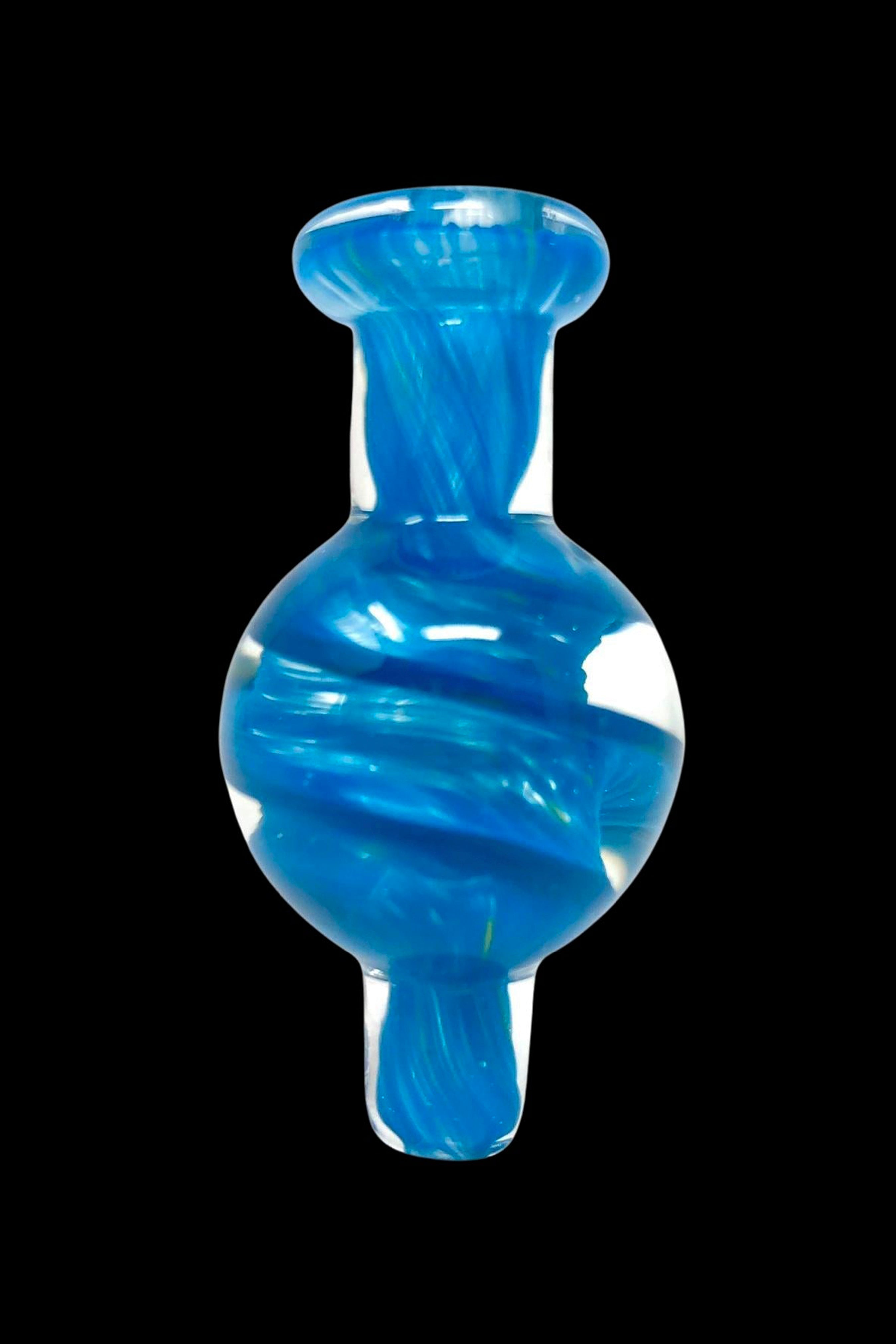 Blue glass dab cap with swirling patterns.