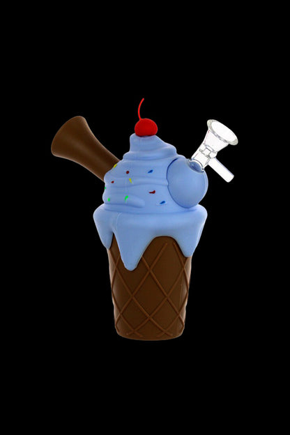 A realistic rendering of an ice cream cone-shaped glass water pipe with a chocolate topping and cherry on top, set against a black background.