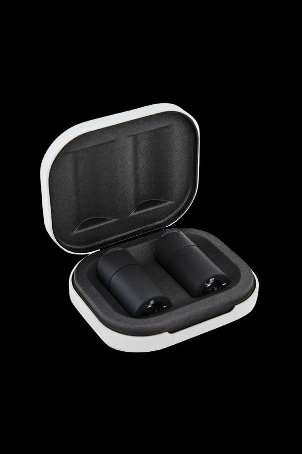 Open white and black carrying case with two cannabis vape pen cartridges inside.