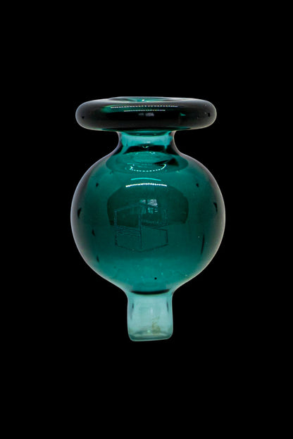 Teal glass oil dome for vaporizing cannabis concentrates.