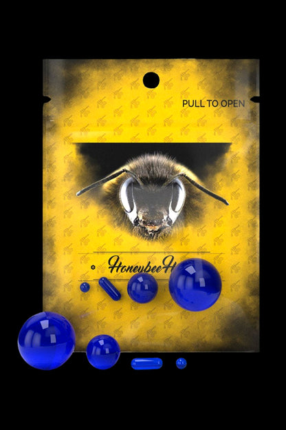 Yellow cannabis packaging with a bee graphic and blue capsules.