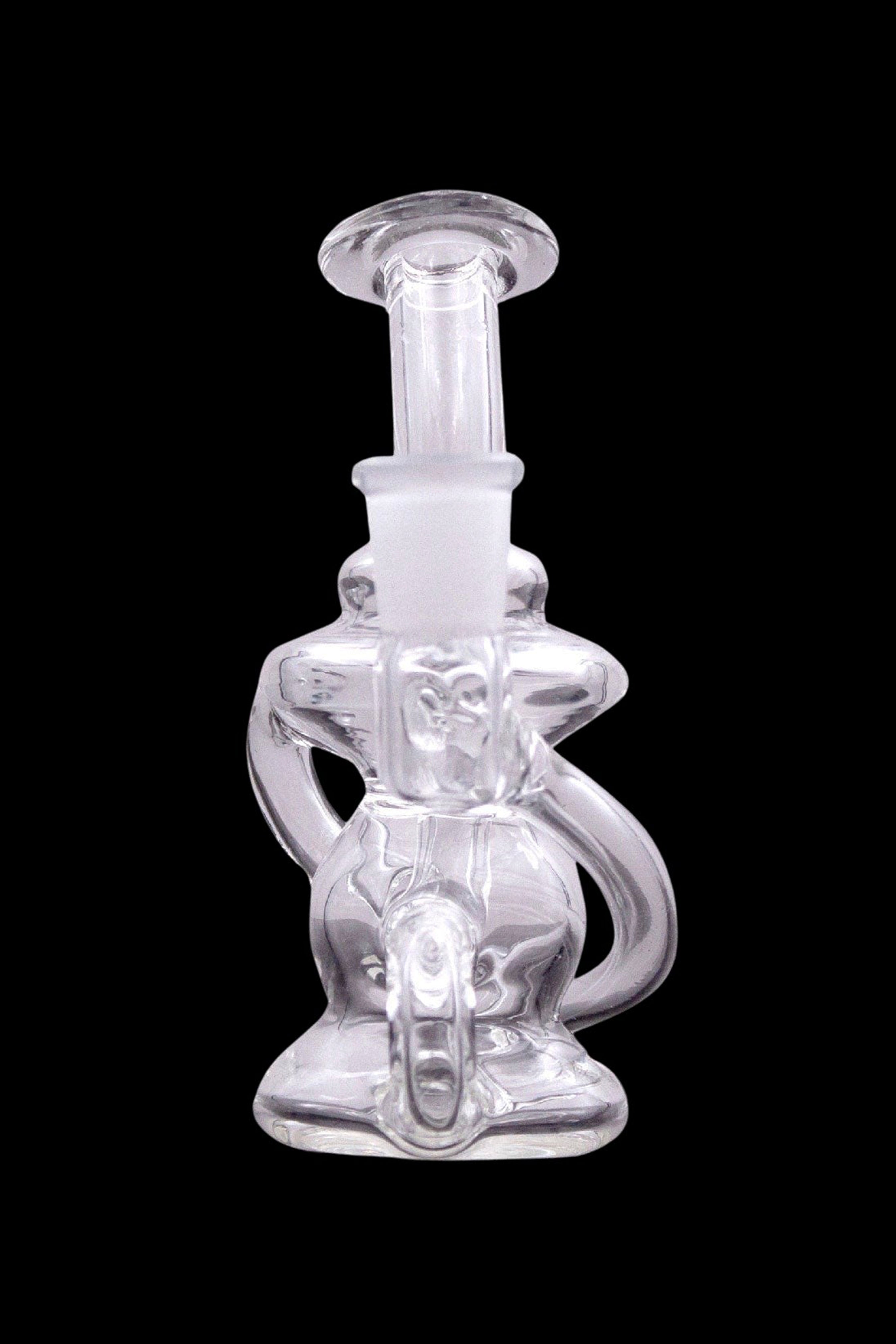 Clear glass dab rig with intricate sculptural design.