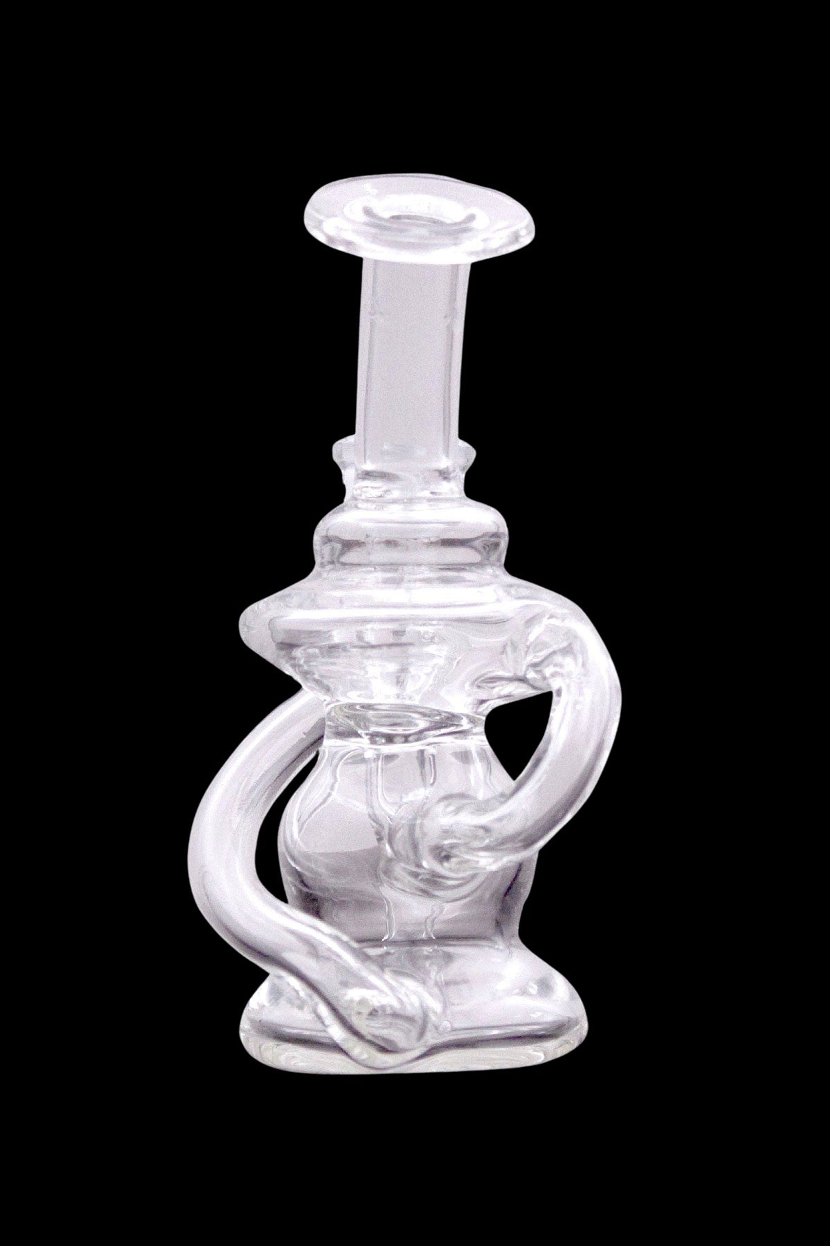 Clear glass dab rig with intricate sculptural design.