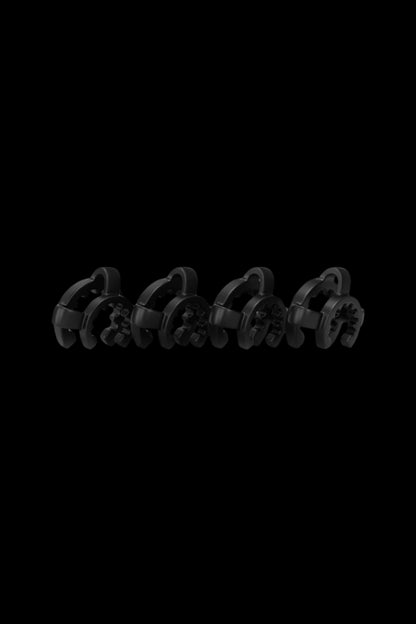 Row of four black Honeybee Herb Keck Clip pieces shown in low-angle lighting against a black background.