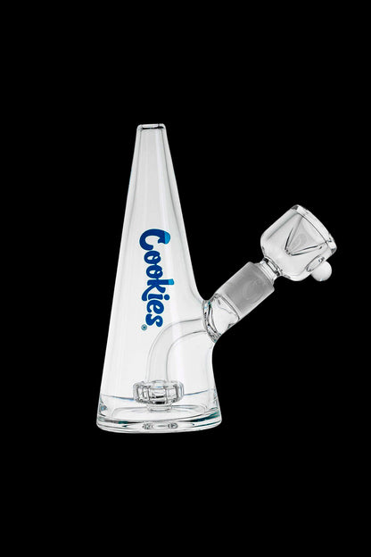 A clear glass water pipe (bong) with a triangular shape and “Cookies” branding.