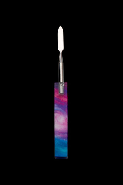 Colorful glass dab tool with a metal tip.