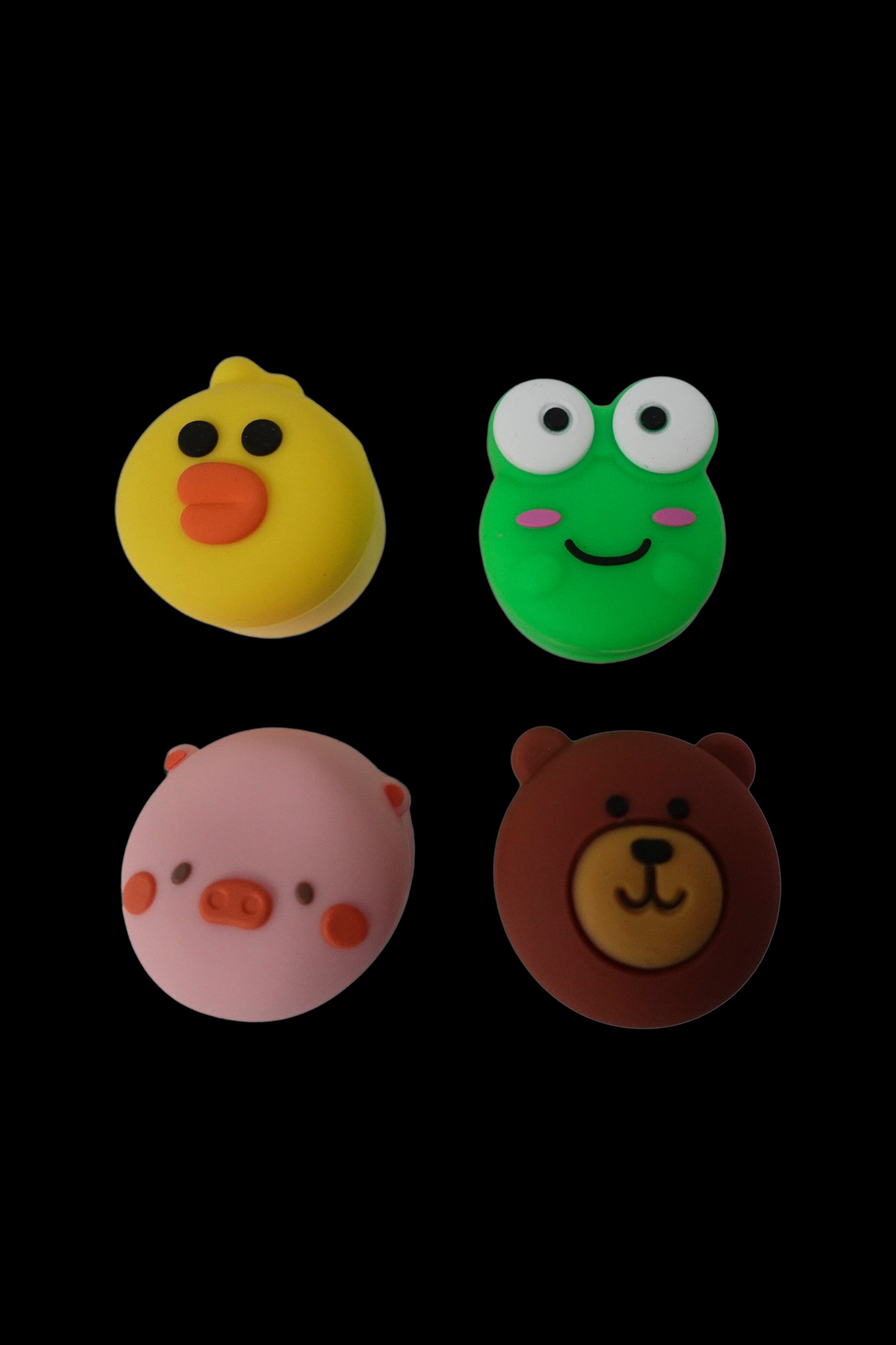 Cute animal-shaped silicone caps for cannabis containers.