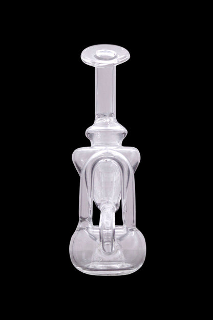 Clear glass dab rig with intricate bubble and stem design, isolated on black.
