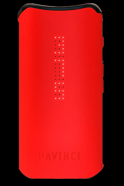Red DaVinci IQ2 vaporizer with illuminated display.