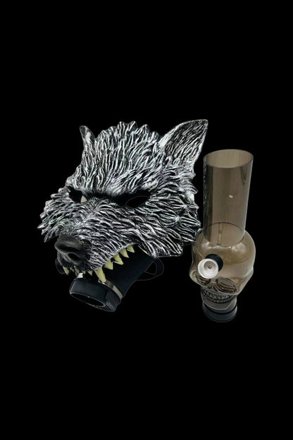 A detailed glass bong shaped like a wolf's head, featuring sharp teeth and textured fur, against a black background.