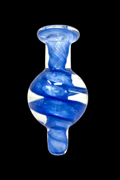 Blue glass dab cap with swirling white patterns.