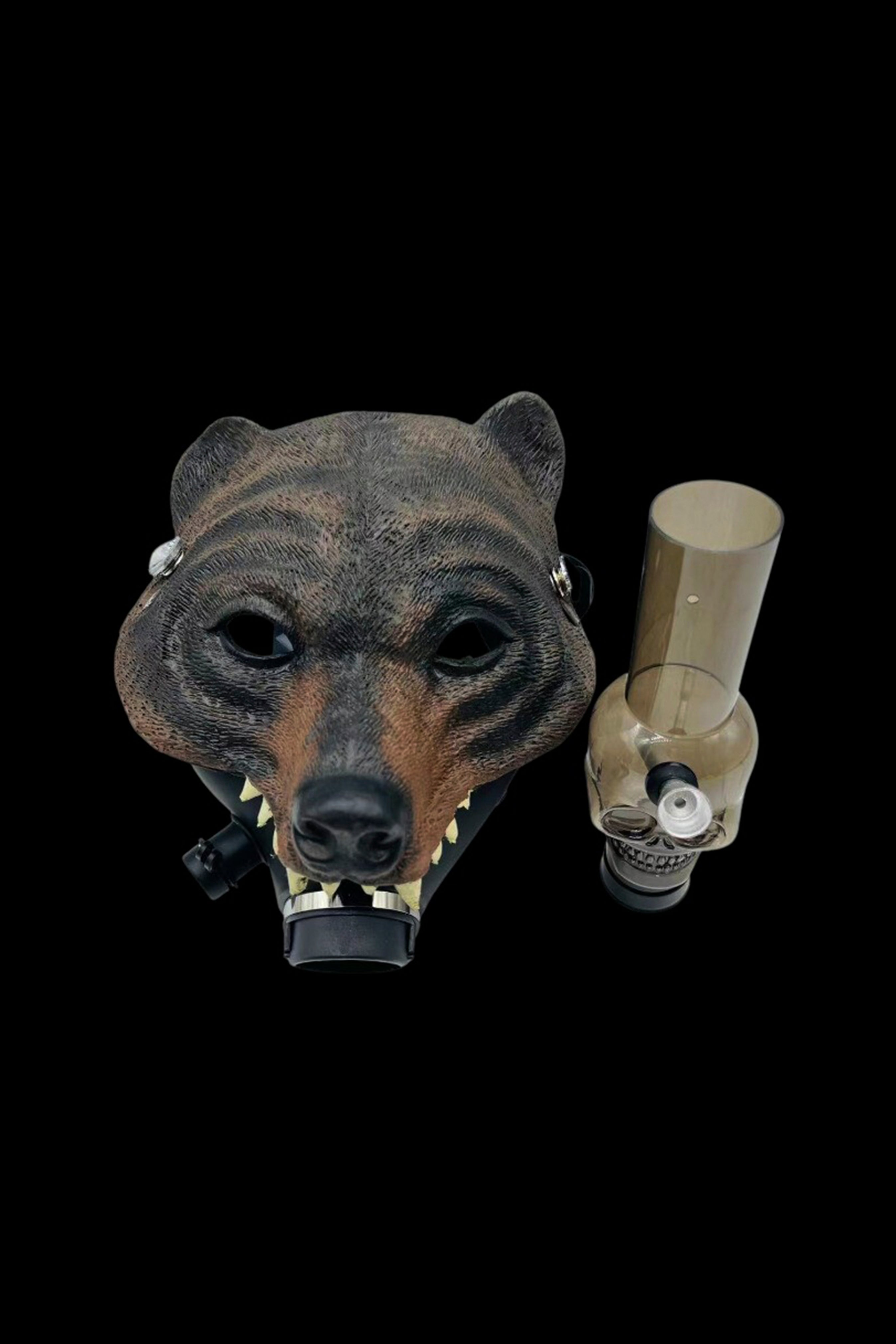 Bear-shaped cannabis water pipe with a metallic rig attached, set against a black background.