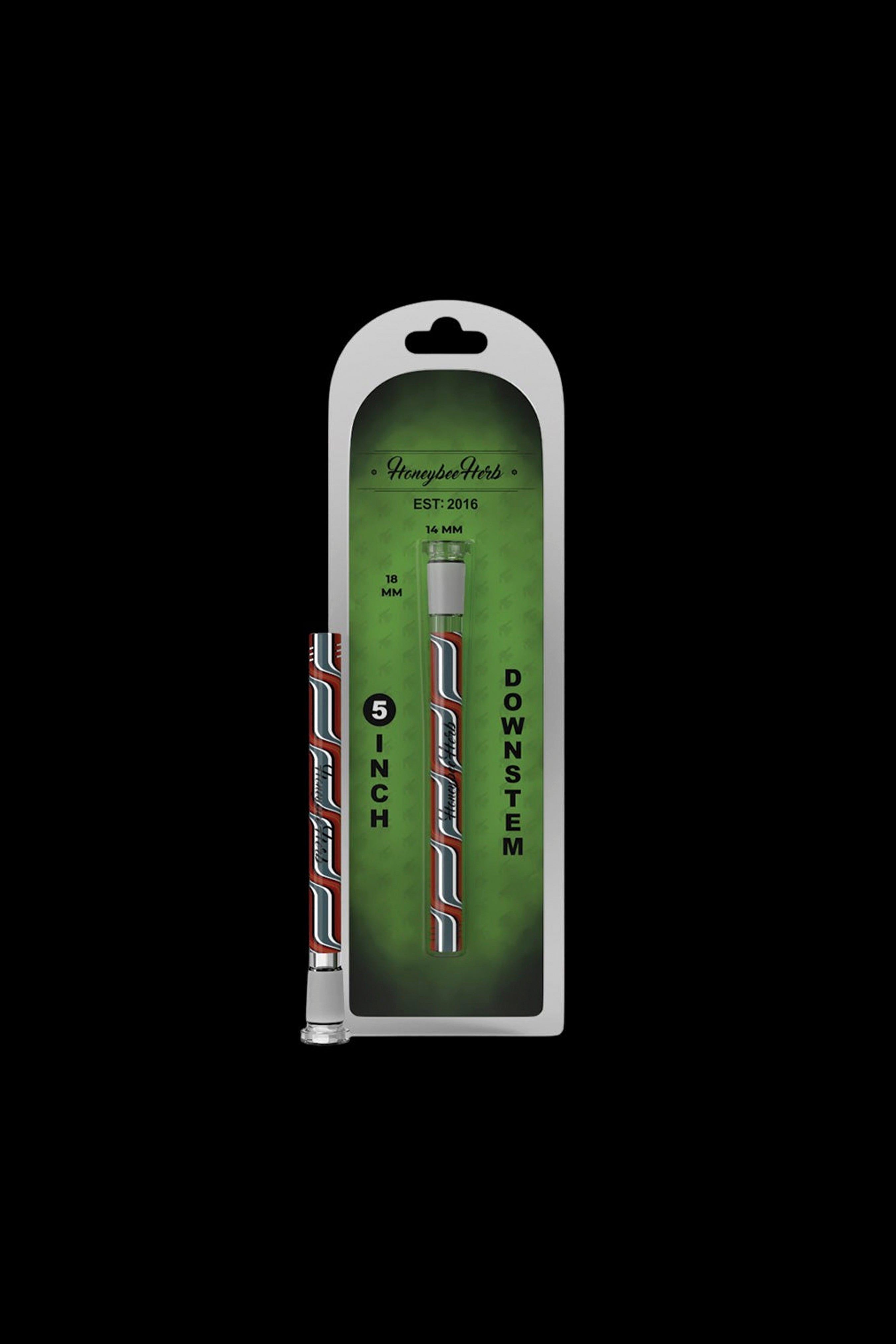 Plastic packaging displaying two 5-inch downstem cannabis accessories with red and clear glass, labeled "Honeybee Herbs" and marked with measurements "18 MM".