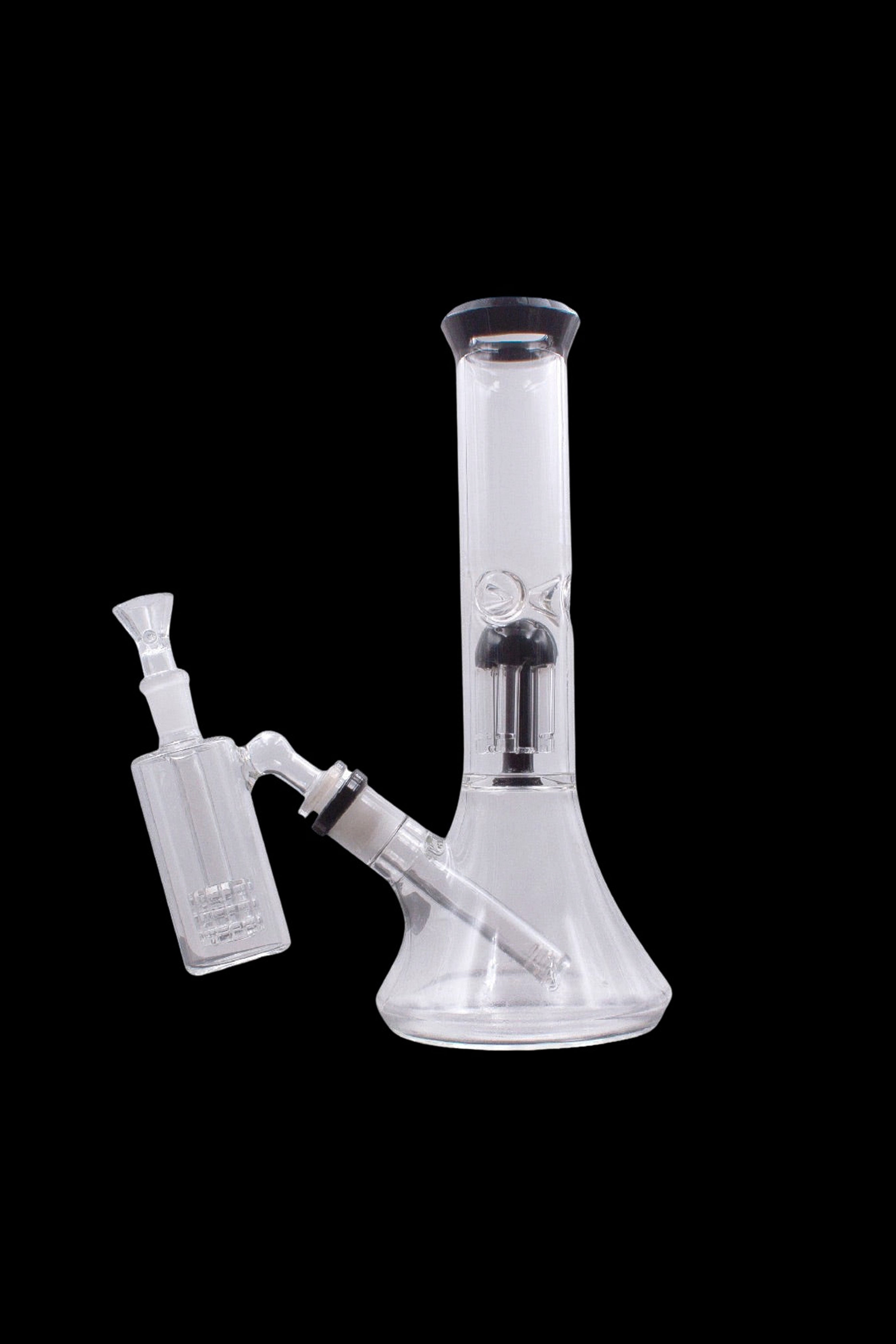 Glass bong with bubbler and downstem, isolated on black.