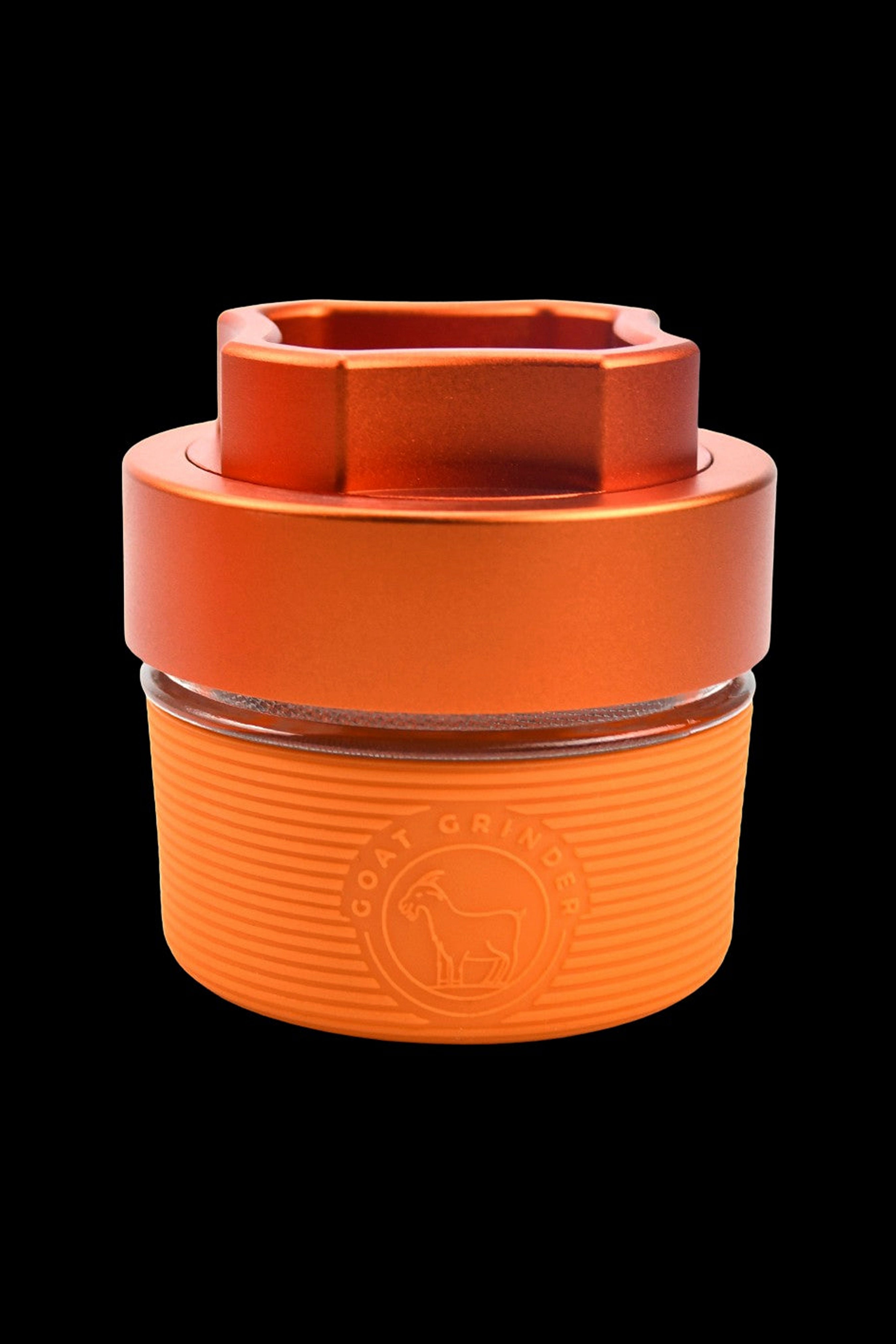 Orange silicone cannabis concentrate container with embossed logo.