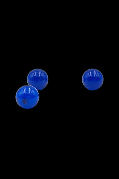 Close-up of three glossy blue spheres on a black background featuring The Stash Shack Sapphire Terp Pearls - 2pc.