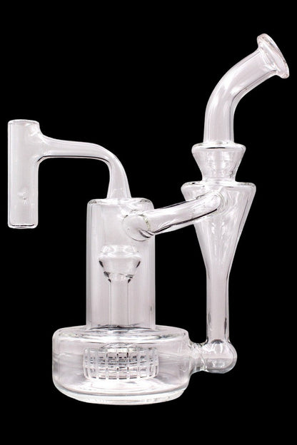 Clear glass water pipe (rig) with multiple chambers and a mouthpiece, isolated on a black background.
