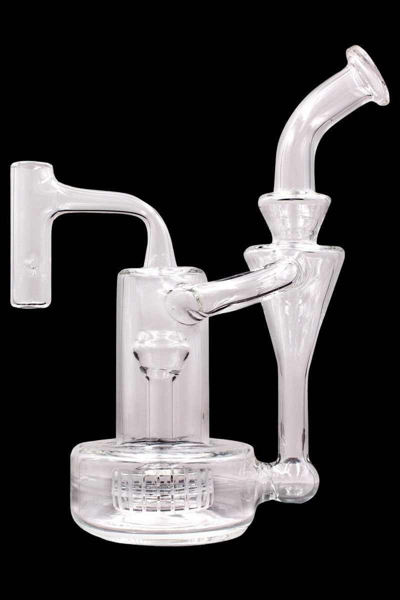 Clear glass water pipe (rig) with multiple chambers and a mouthpiece, isolated on a black background.