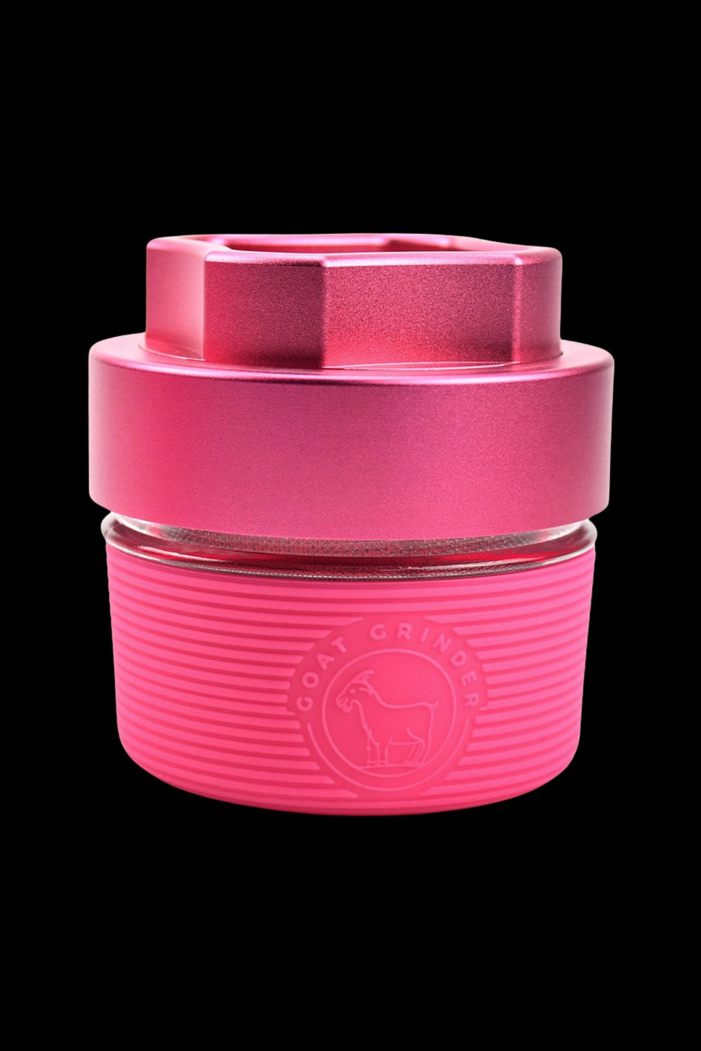 Pink silicone cannabis concentrate container with a metallic inner cup and branded logo.