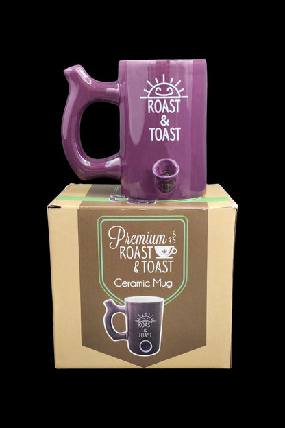 Purple ceramic mug with "Roast & Toast" logo, displayed with its retail box labeled "Premium Roast & Toast Ceramic Mug".
