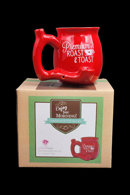 Red ceramic cannabis water pipe shaped like a vintage bicycle, displayed with its branded packaging, labeled “Premium Roast & Toast.”