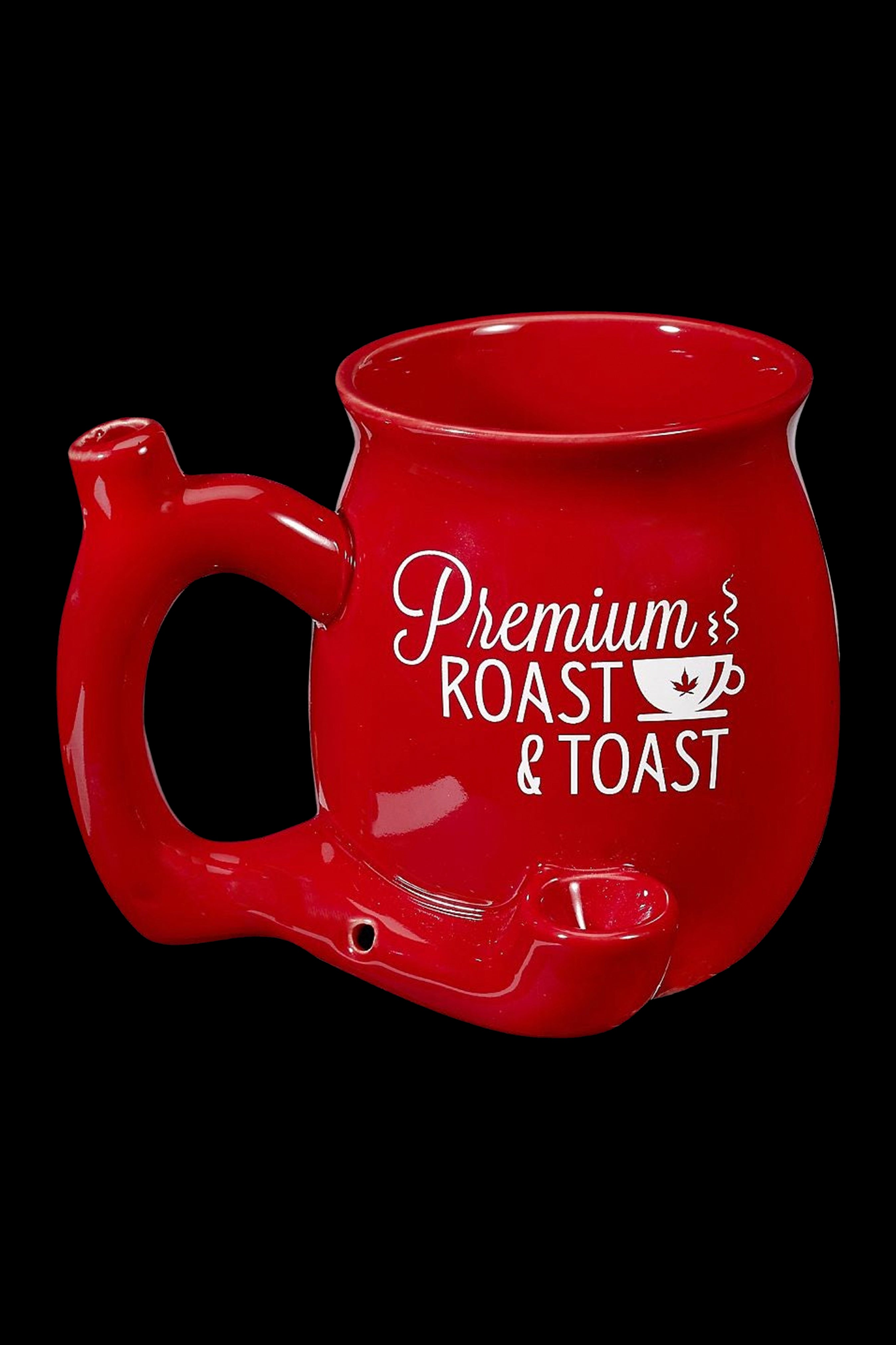 Red ceramic apple-shaped smoking piece with “Premium Roast & Toast” lettering and cannabis leaf graphic.