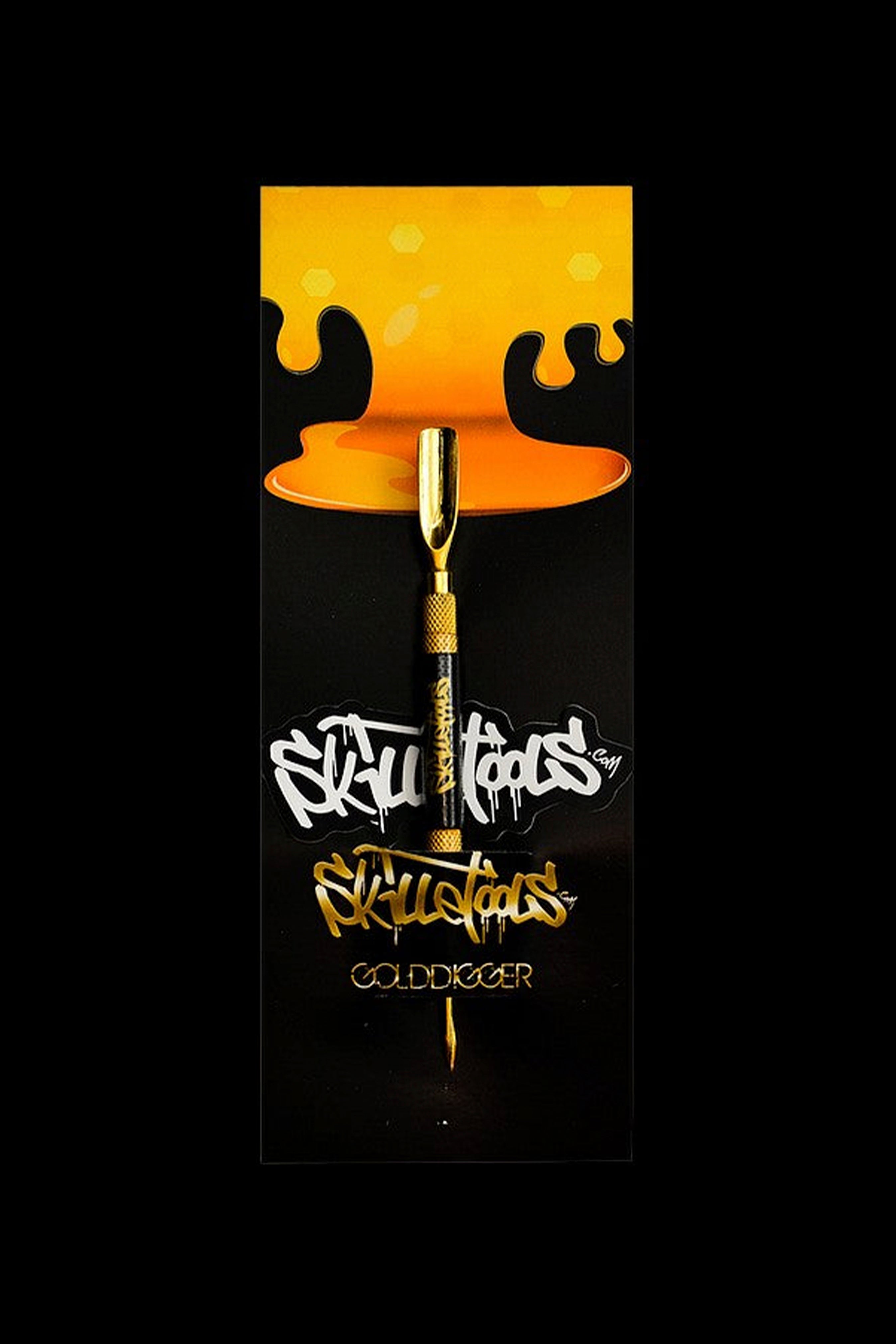 Product shot of a gold cannabis dab tool with orange dripping accents and “SKU Tools” branding on a black background.