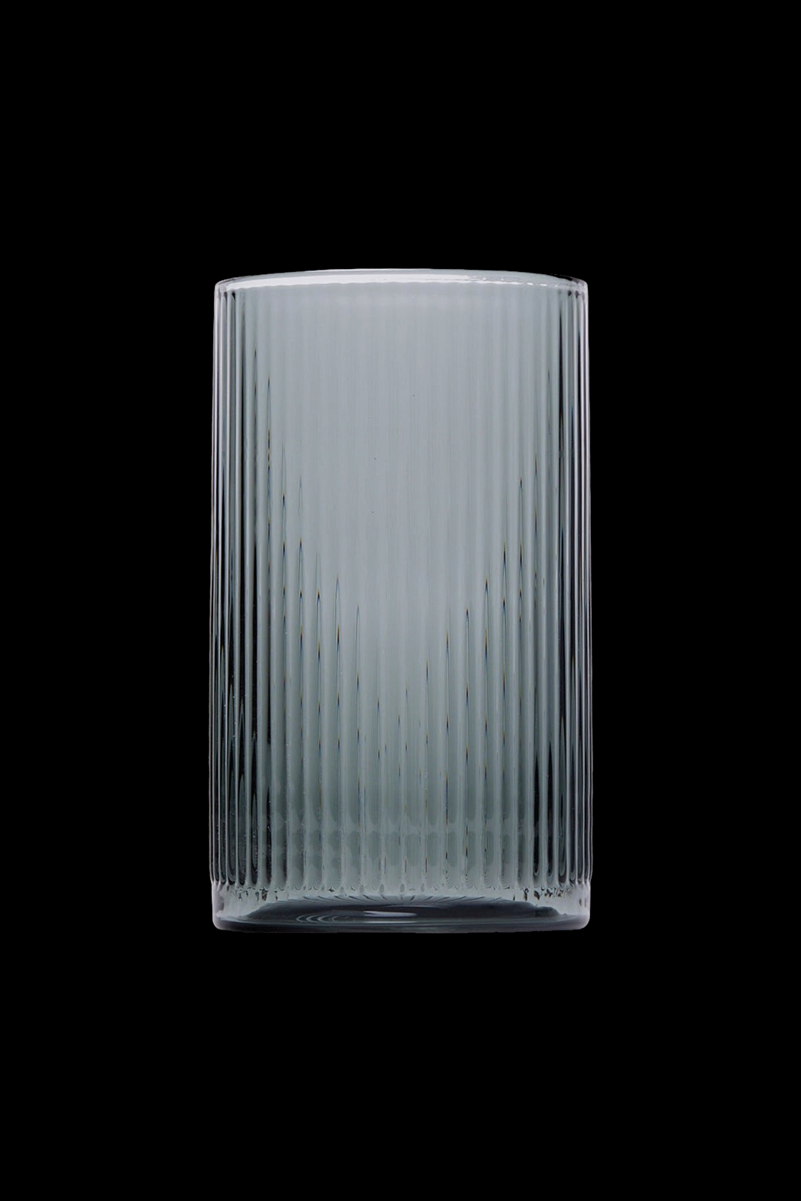 Ribbed glass smoking pipe against a black background.