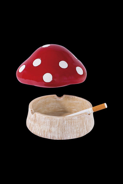 Red mushroom ashtray with a partially smoked joint inside.
